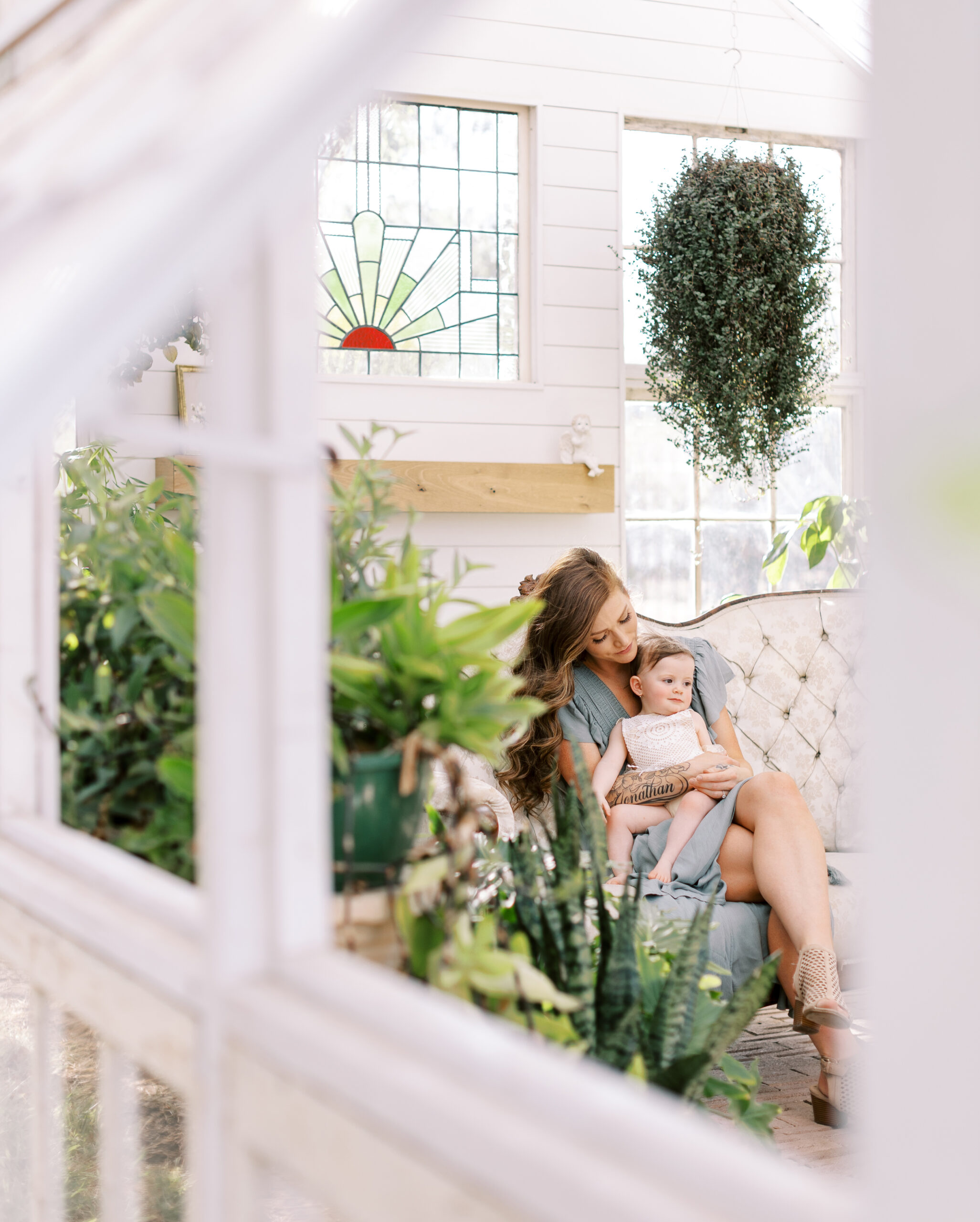 Mommy and Me session in a greenhouse.
